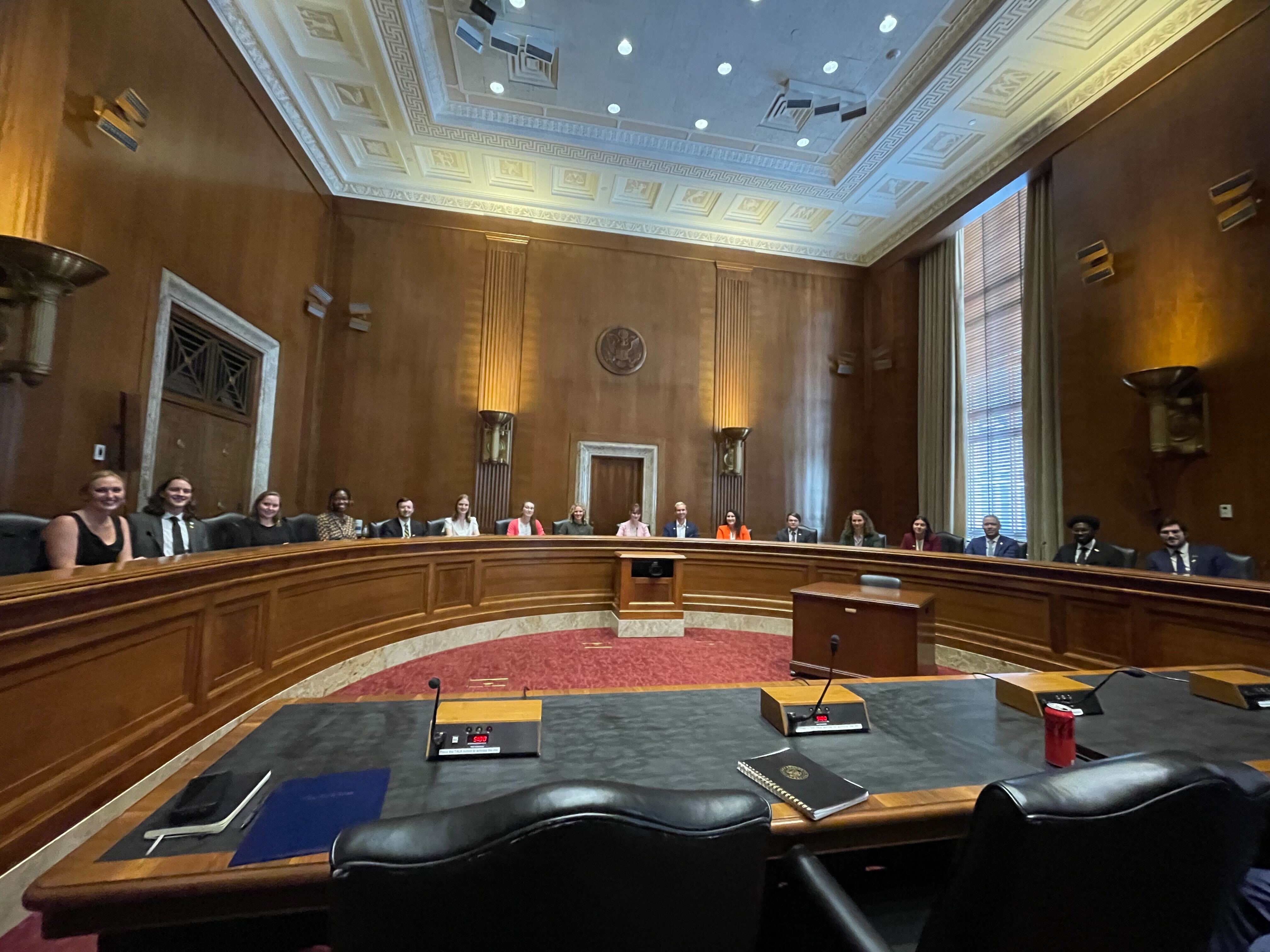 The 2024 Nuclear Engineering Student Delegation (NESD) in a Senate Committee room with ANS congressional fellows.